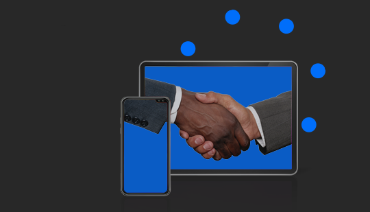 A tablet and a smartphone displaying an image of two people shaking hands on blue backgrounds, with blue dots in the surrounding area.